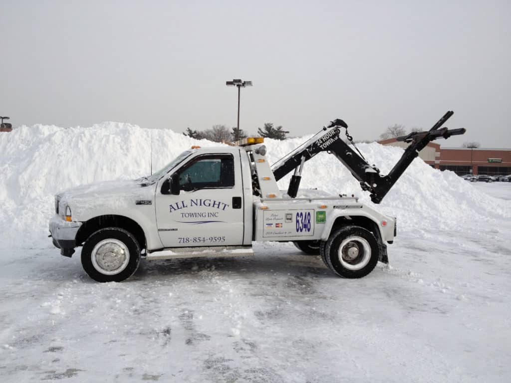 Winch Out Of Snow & Ice - All Night Towing Recovery & Auto Repair